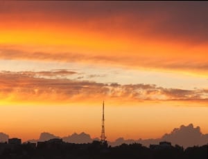 black tower under orange sunset thumbnail