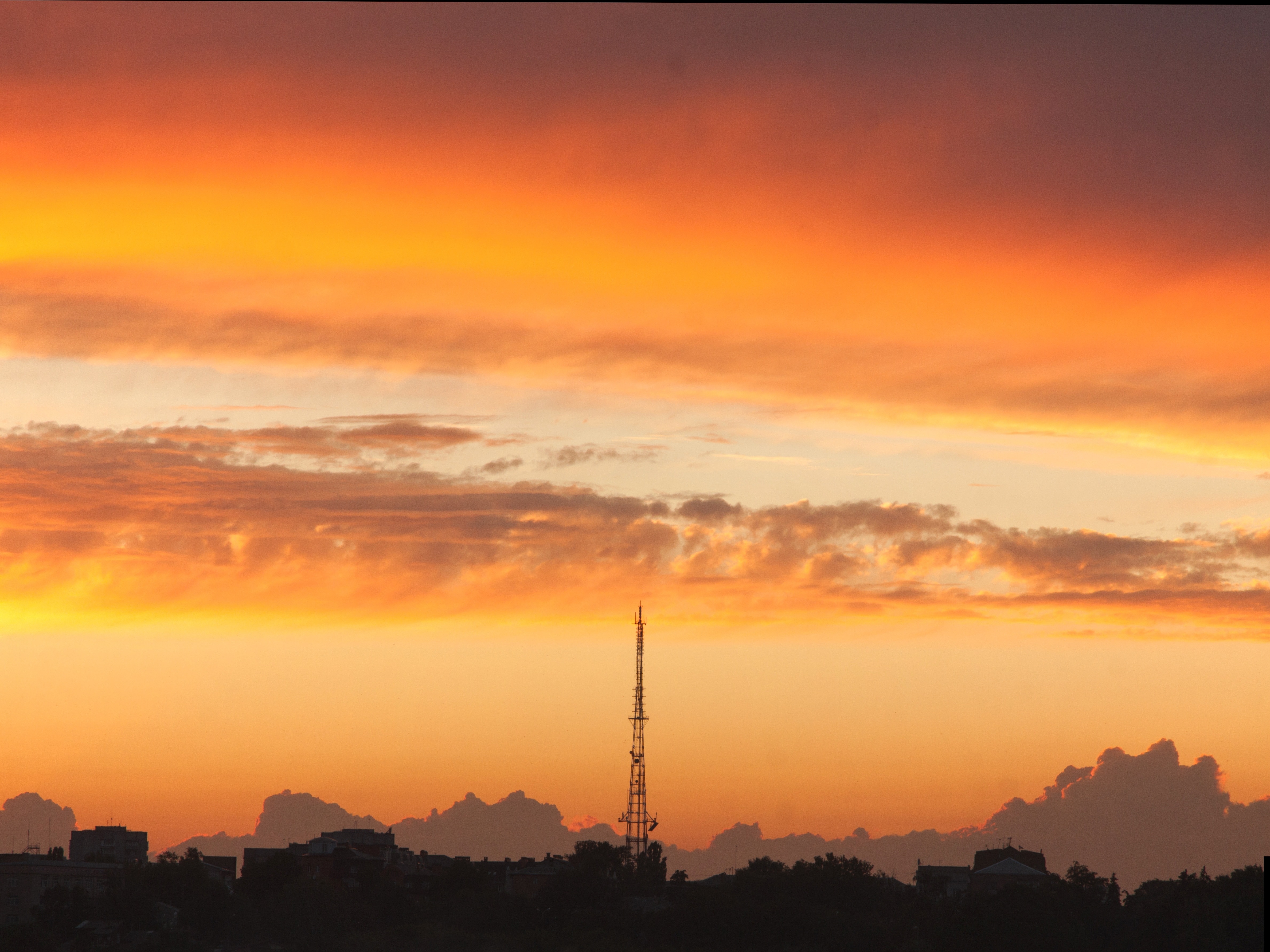 black tower under orange sunset