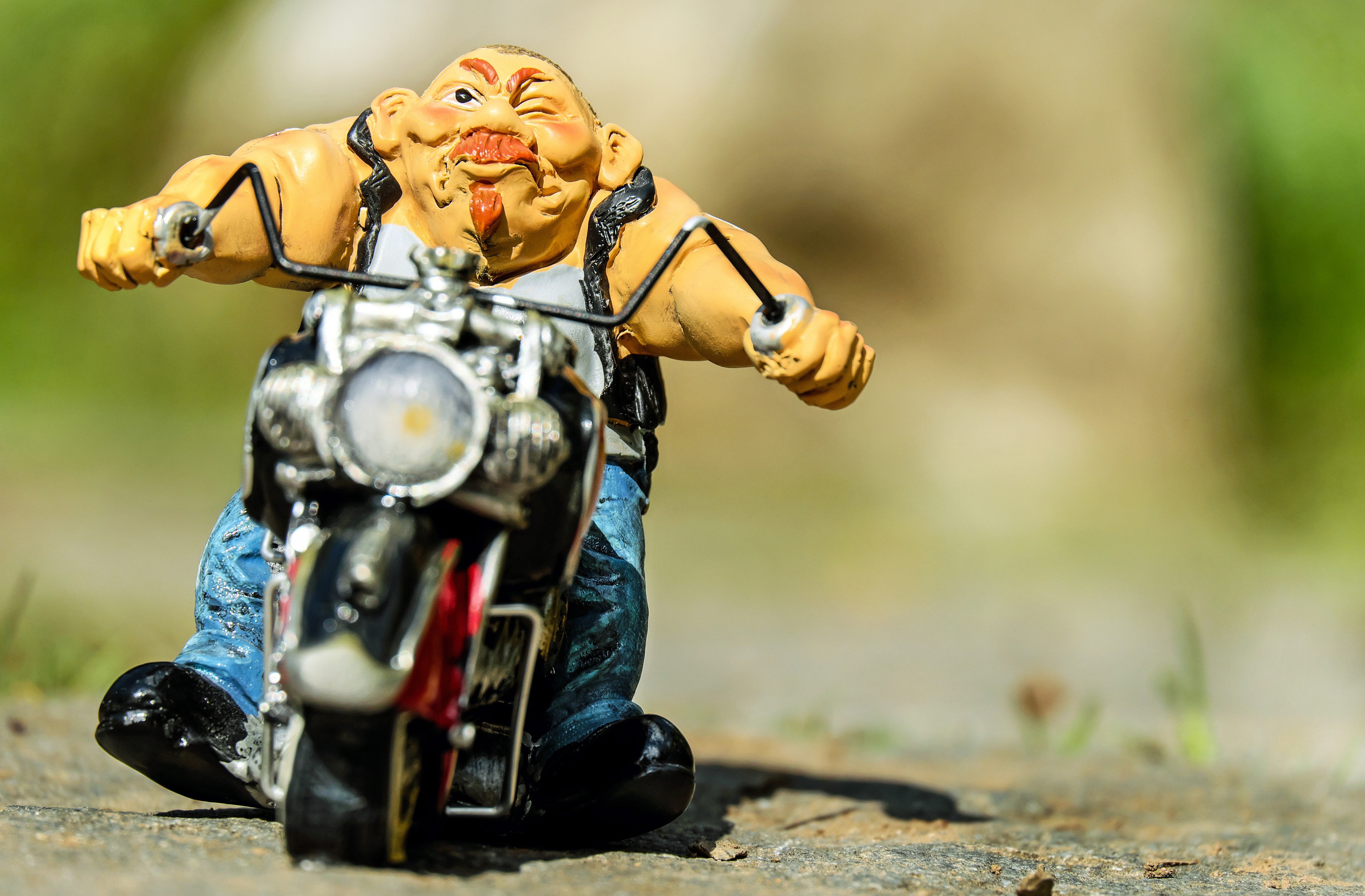 man riding motorcycle figurine