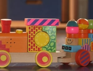 brown yellow and green multi-colored wooden activity train thumbnail
