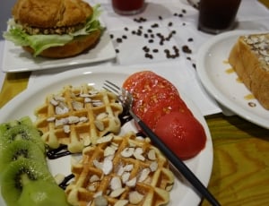 waffle tomatoes on white ceramic round plate and black and stainless steel fork thumbnail
