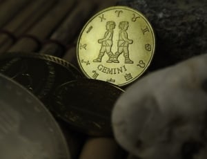 closeup photo of coins on wooden surface thumbnail