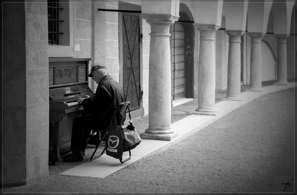 man playing piano gray scale portrait preview