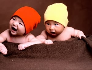 baby's red and yellow beanie thumbnail