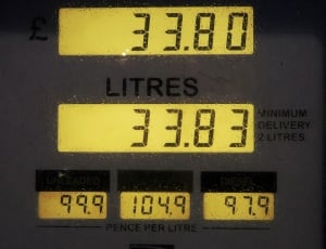 black gasoline station monitor at 33.80 and 33.83 litter 99.9 104.9 97.9 pence per litre thumbnail