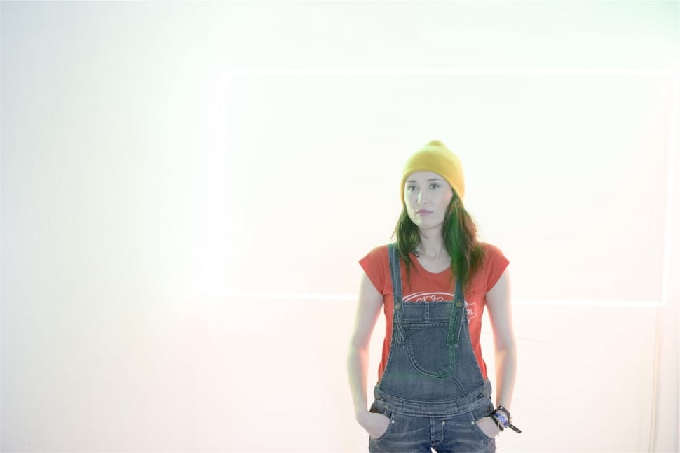 women's blue denim dungaree and yellow knit cap preview