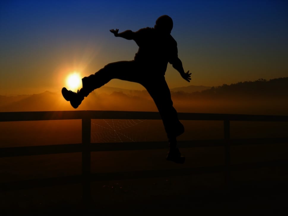 silhouette photo of man jumping preview