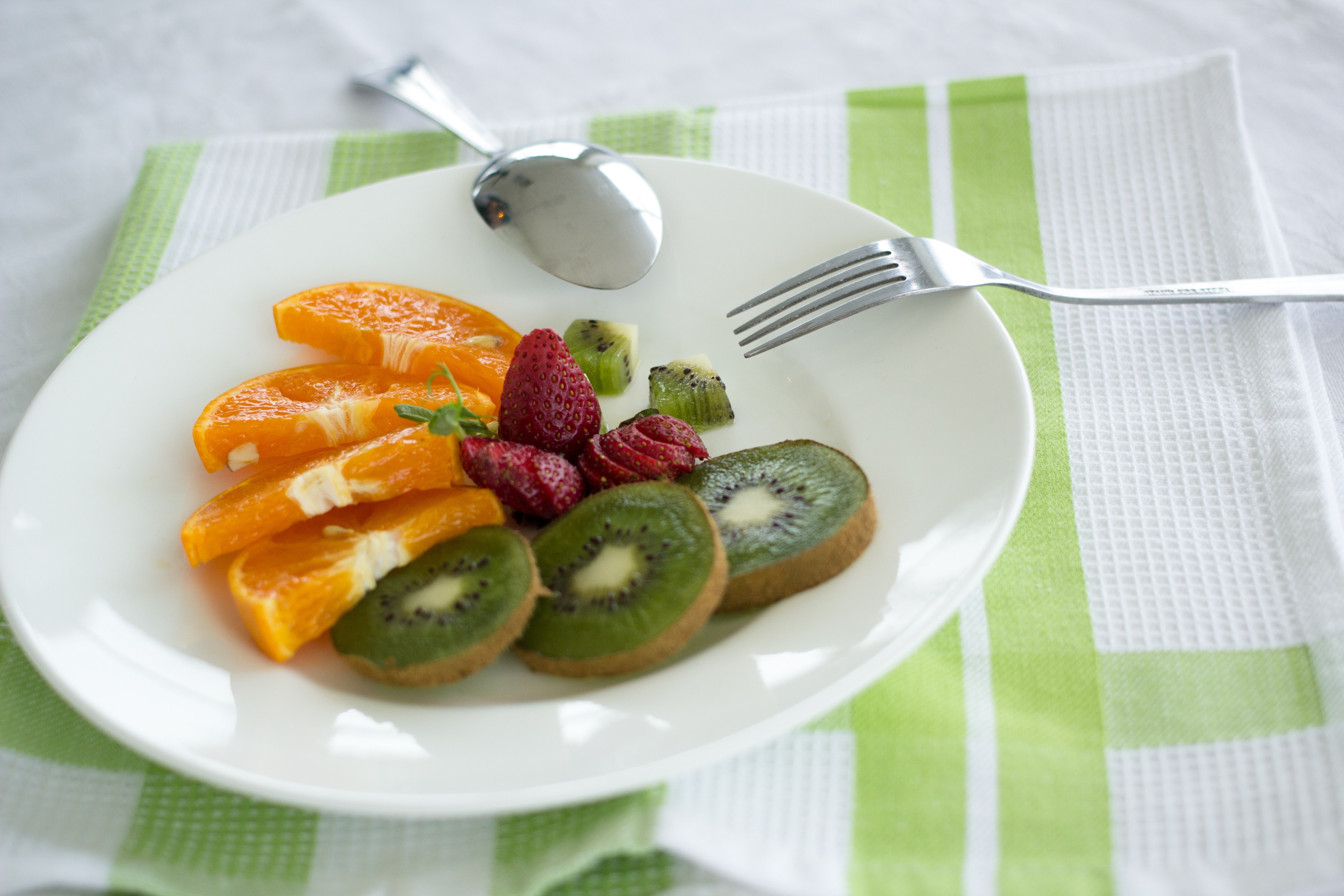 photo of strawberry, orange, and kiwi fruits