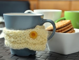 ceramic mugs set and bowl of biscuits thumbnail
