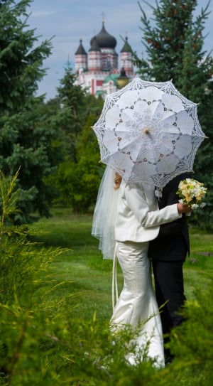 man in woman in white and black suit photo thumbnail
