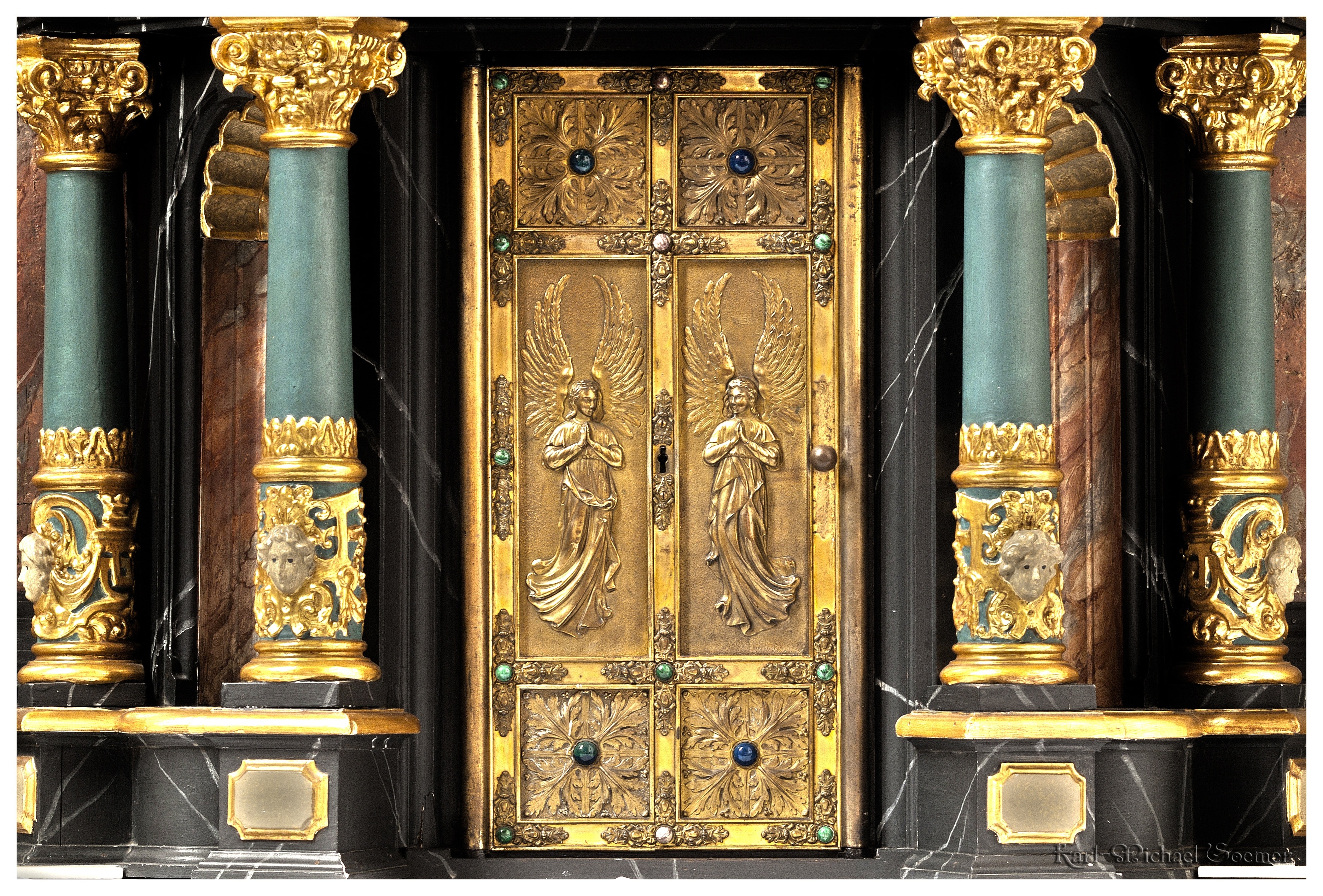 gold and grey pillars and door