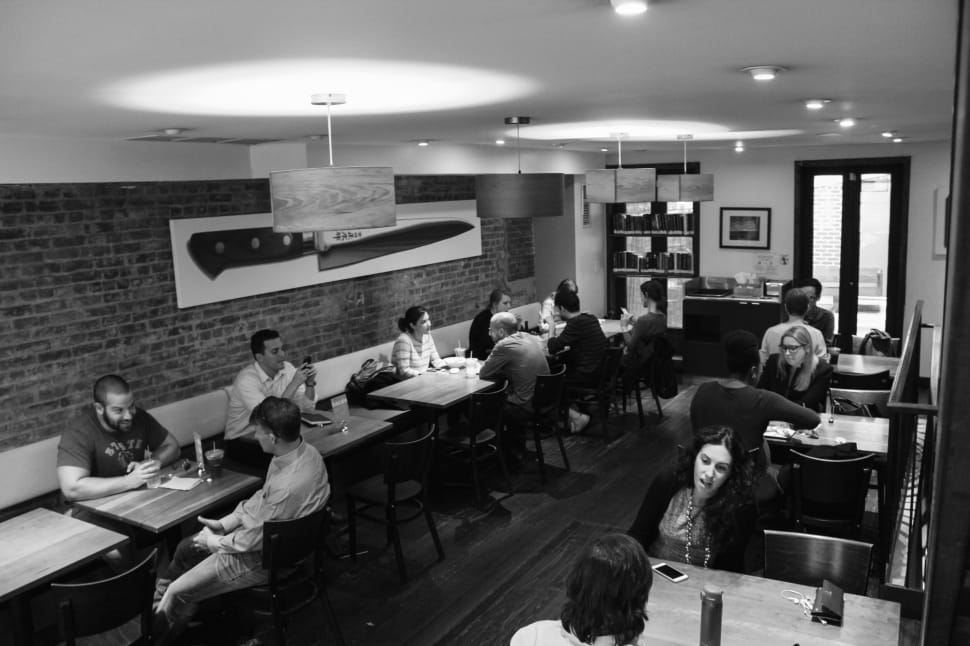 gray scale photo of people in restaurant preview