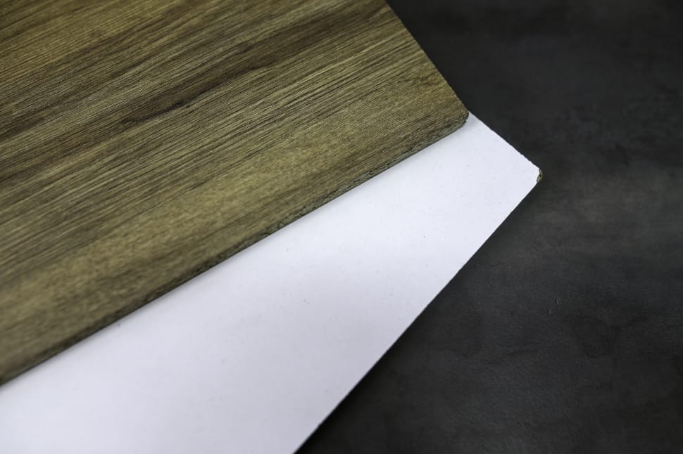 brown wooden surface on top of white and black textile preview