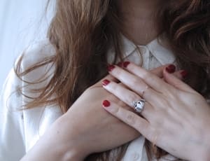 women's silver ring and red manicure thumbnail