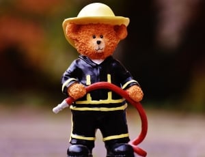 bear in black fireman suit figurine thumbnail