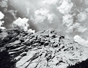 greyscale photography of rocky mountain during daytime thumbnail