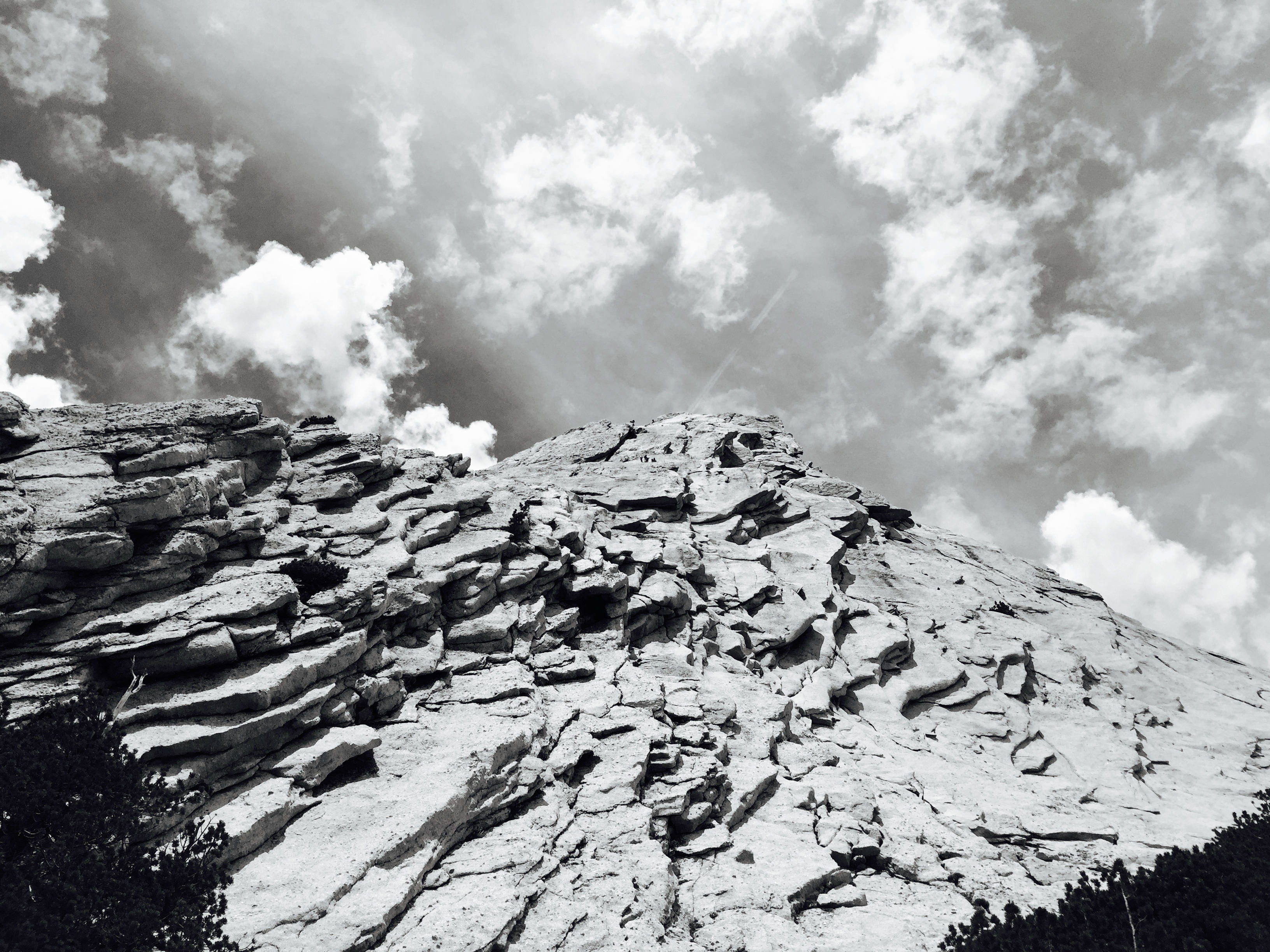greyscale photography of rocky mountain during daytime