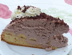 slice of cake with chocolate frosting and vanilla icing thumbnail