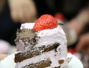 pink and brown cake with strawberry topper thumbnail