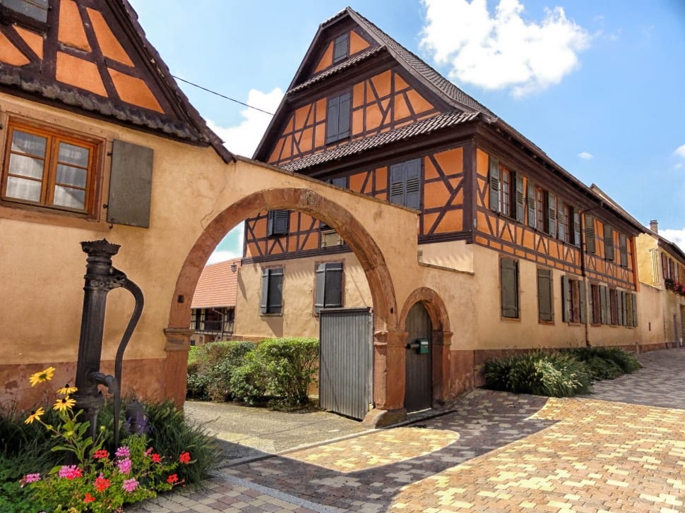 building with arch gate during day preview