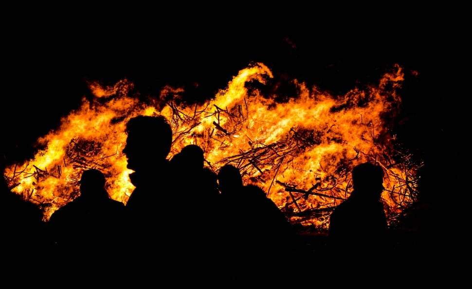 silhouette of people near fire preview