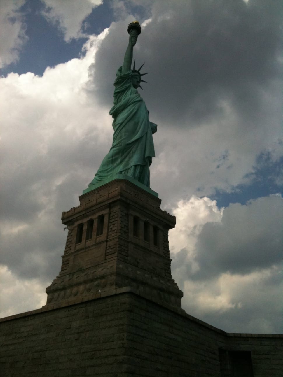 Statue Of Liberty under the white and blue sky during daytime preview