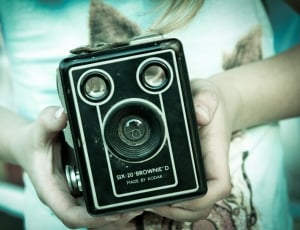 person holding black six 20 brownie device thumbnail