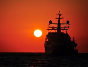 silhouette of boat during sun set thumbnail