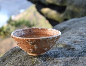 brown and white ceramic bowl thumbnail