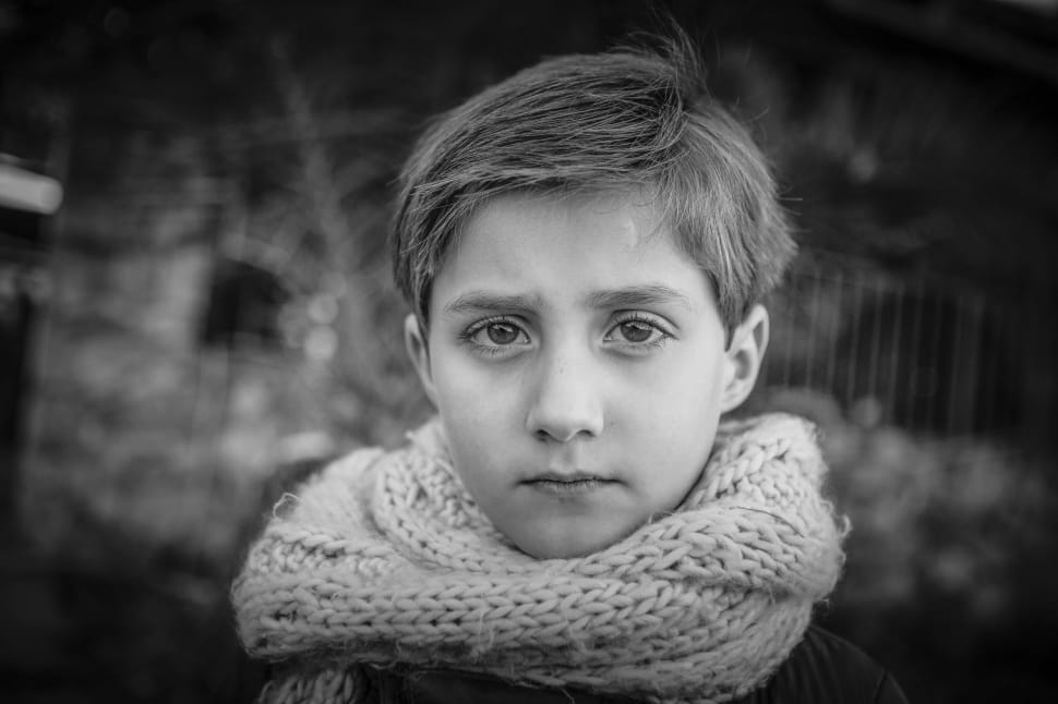 grey scale of boy wearing infinity scarf posing for photo preview