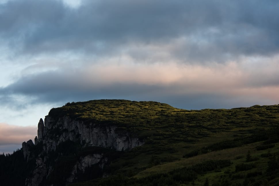landscape photograph of cliff during cloudy skies preview