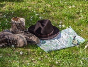 pair of brown boots and hat thumbnail