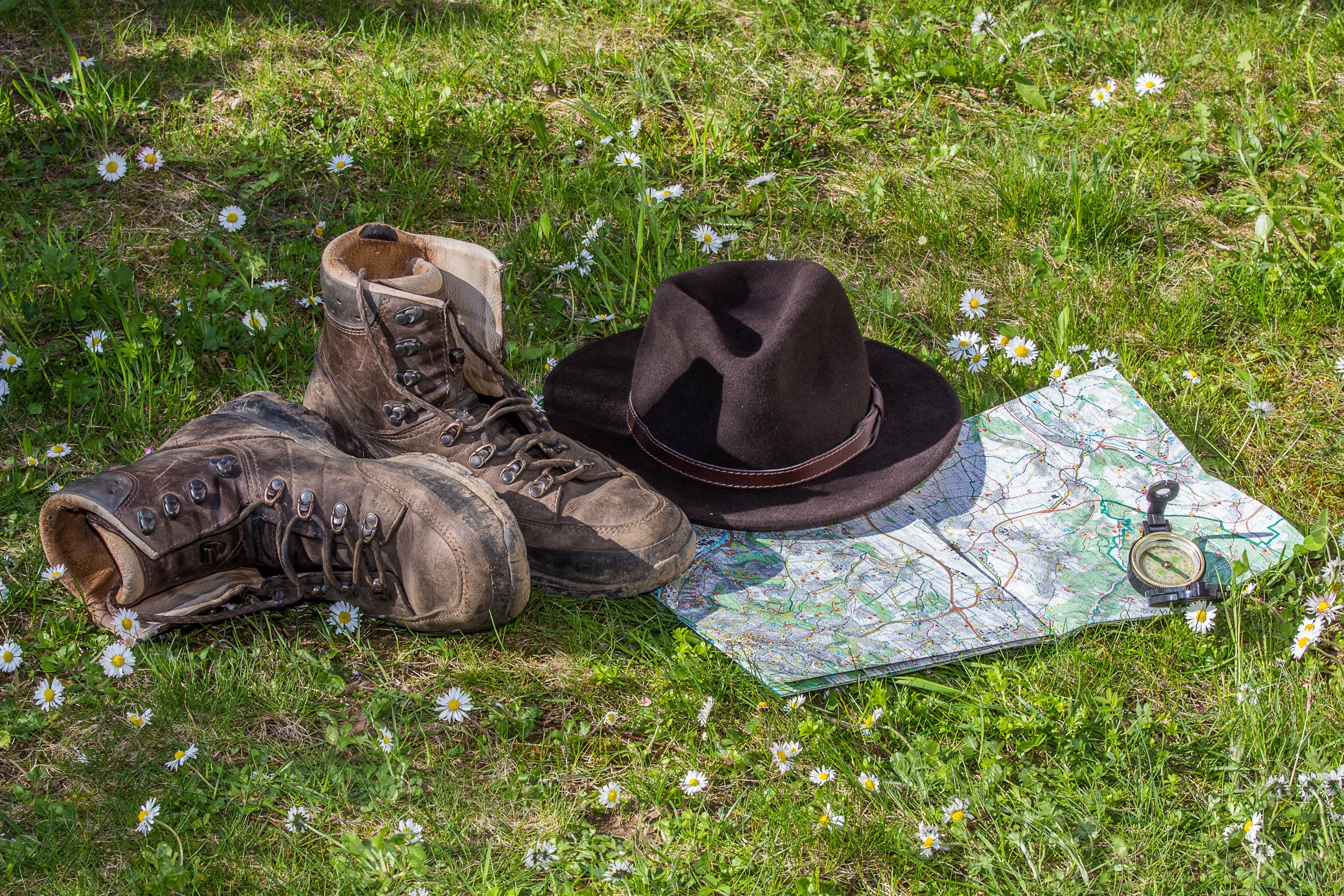 pair of brown boots and hat