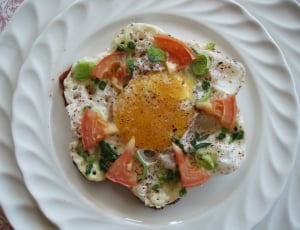 sunny side up with red tomato and green leaf vegetables thumbnail