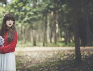 women's red long sleeve shirt and white skirt thumbnail