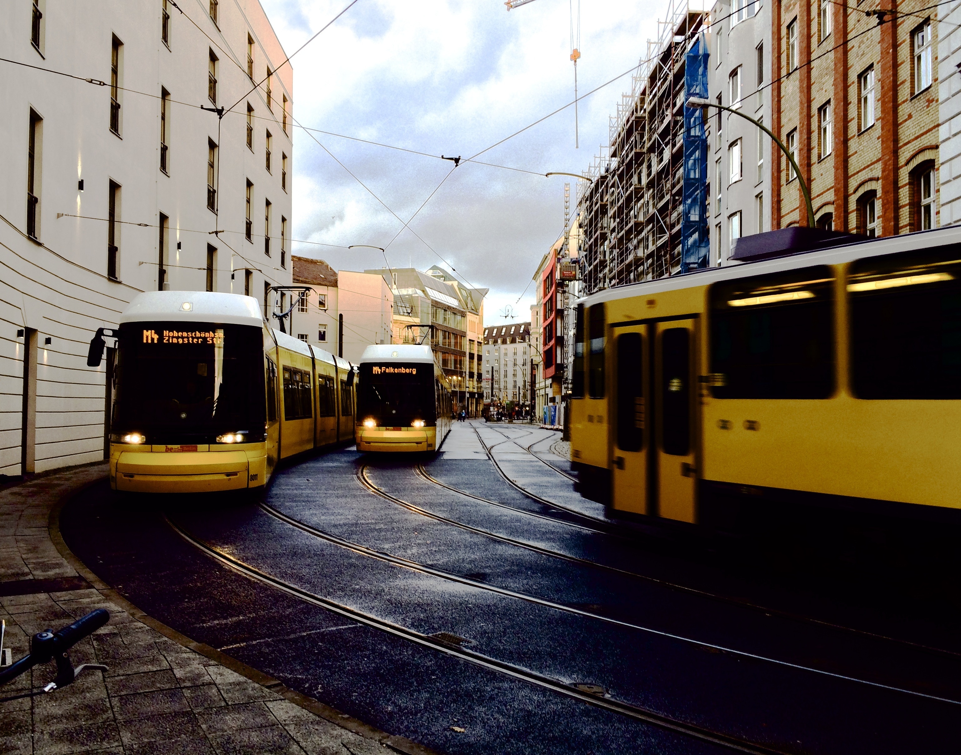 3 yellow trams