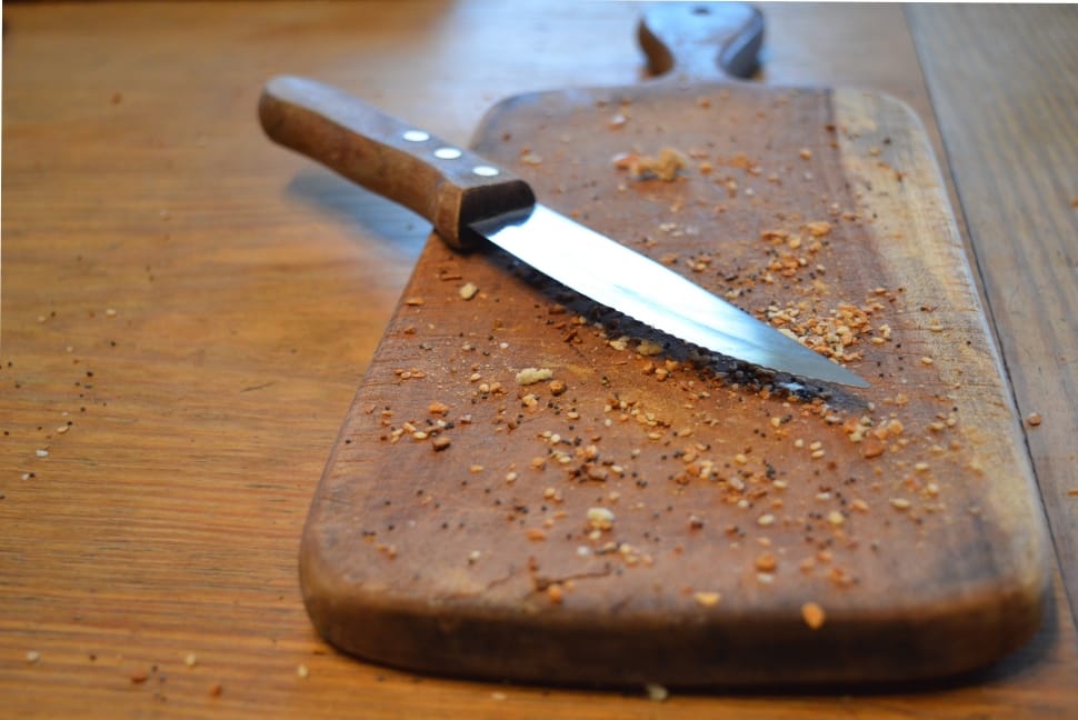 brown handle kitchen knife and chopping board preview