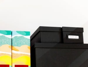 black boxes beside yellow and green printed boxes thumbnail