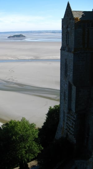 gray concrete tower near sand thumbnail