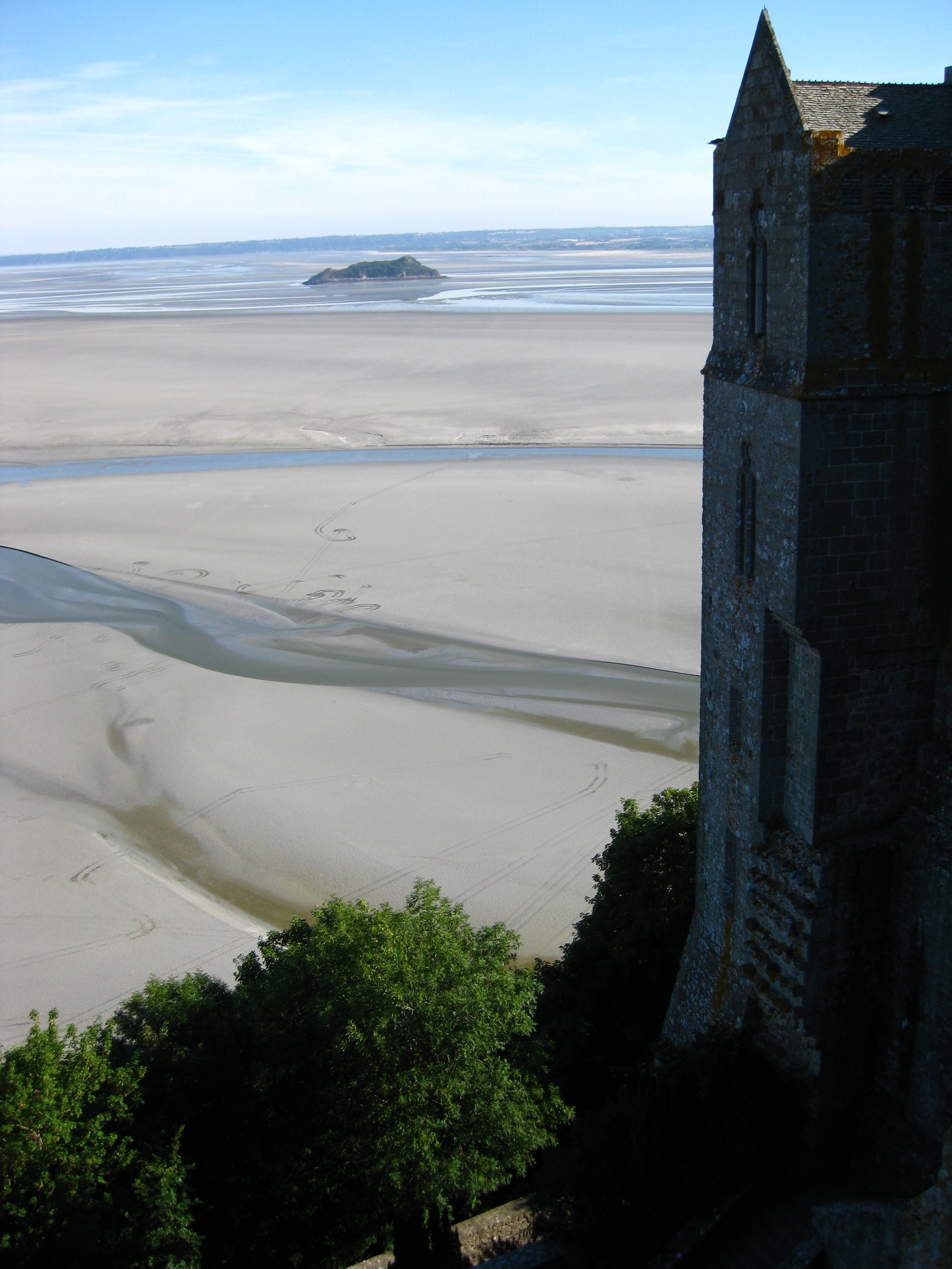 gray concrete tower near sand