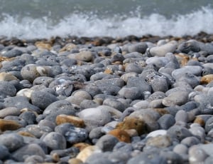 photo of gray stones near seashore thumbnail