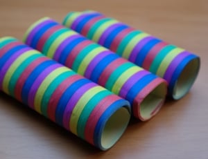 3 green yellow and blue rolled toys thumbnail