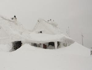 2 houses covered with snows thumbnail
