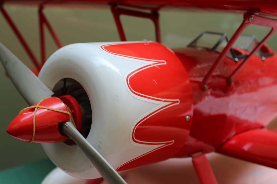 red and white toy plane preview