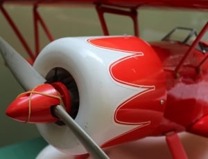 red and white toy plane thumbnail