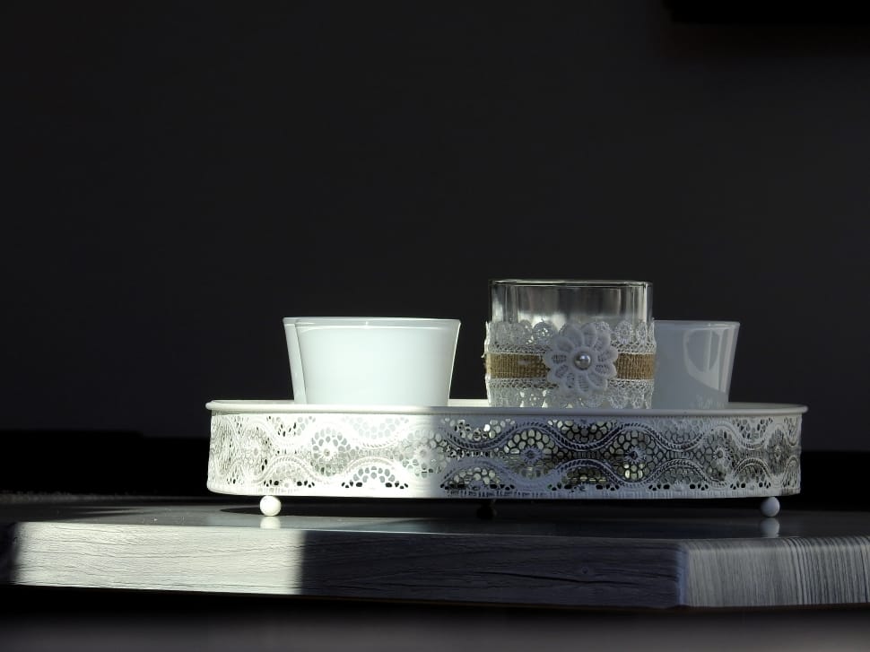 white and clear glass container on oval tray preview