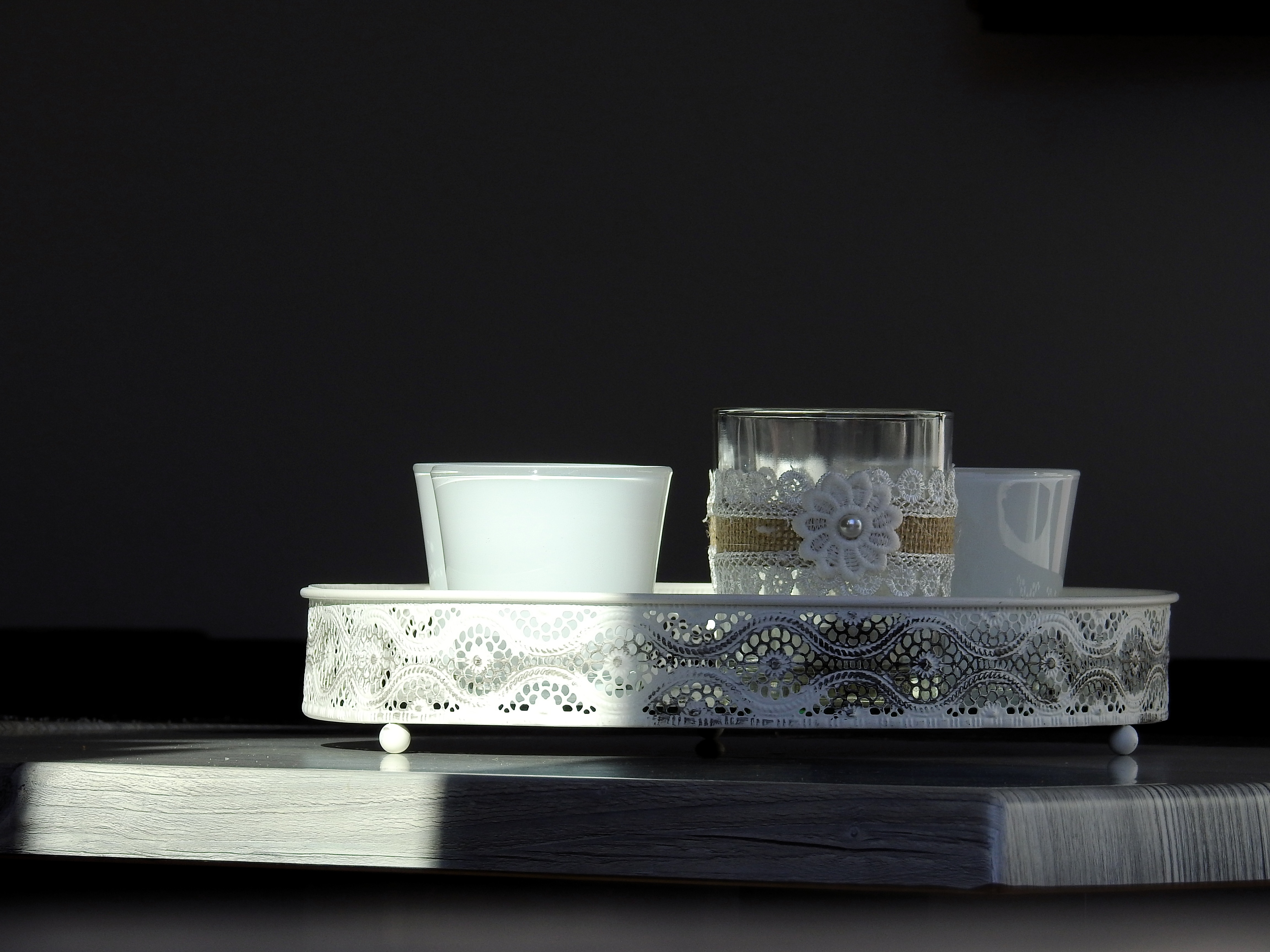 white and clear glass container on oval tray