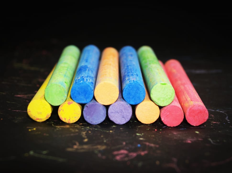 assorted colors of chalks on wood preview