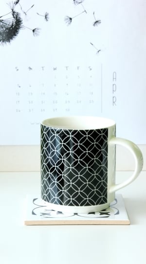 white and black ceramic mug thumbnail