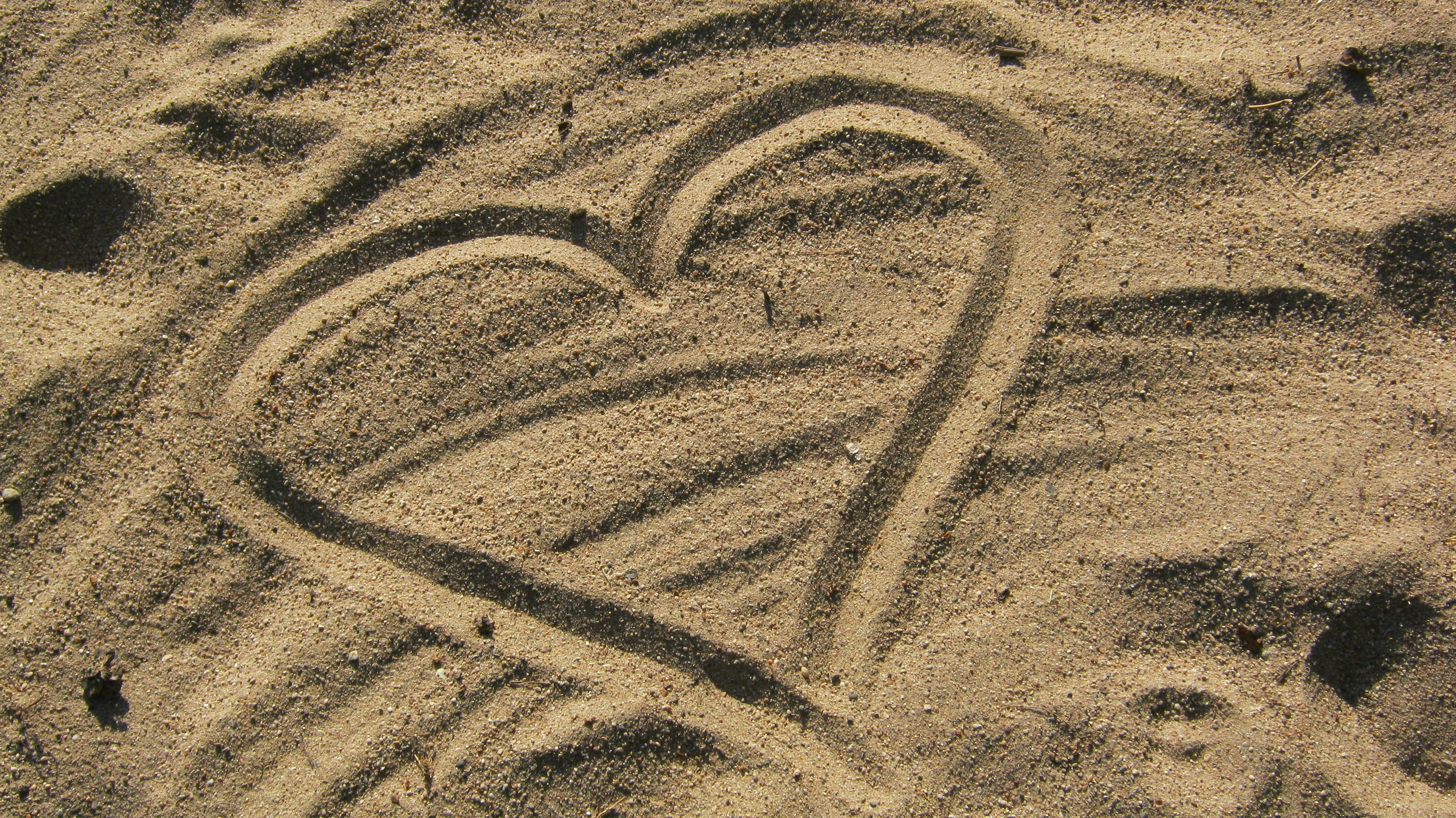 heart shape on brown sand